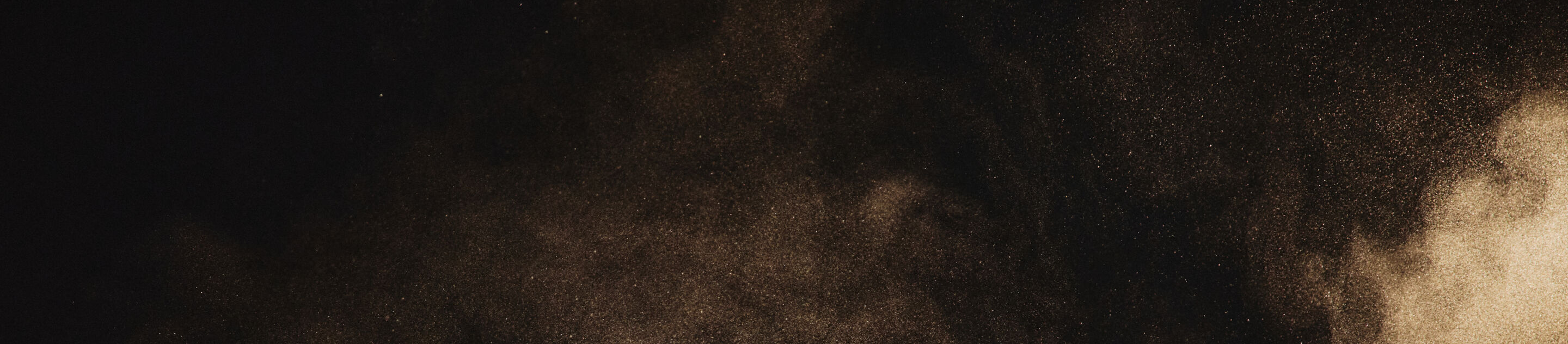 A zoomed in image of a dust cloud in the dessert.