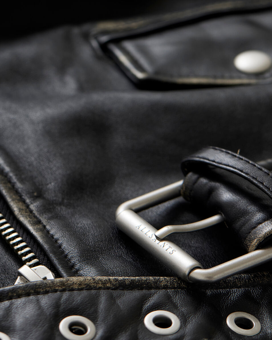 Close up shot of metal detailing on leather jacket. 