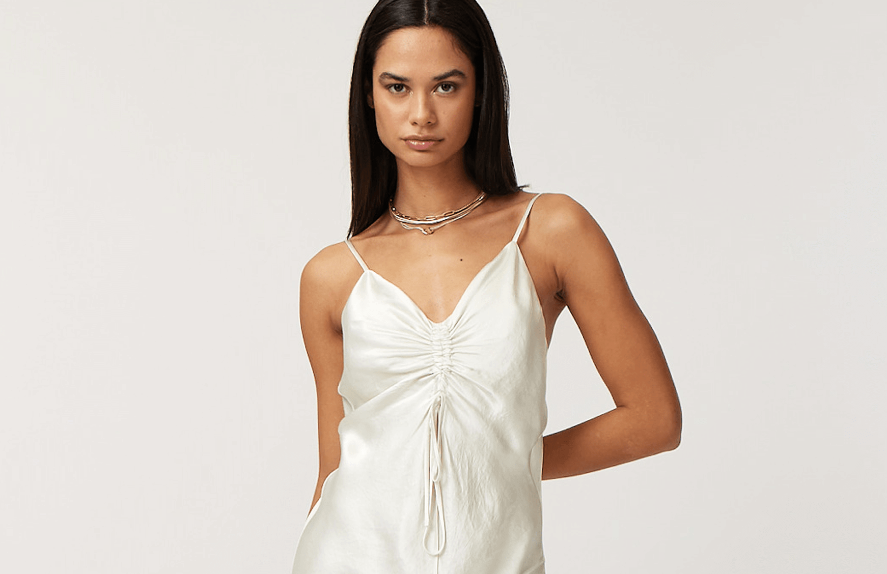 Woman Wearing A Silk White Slip Dress