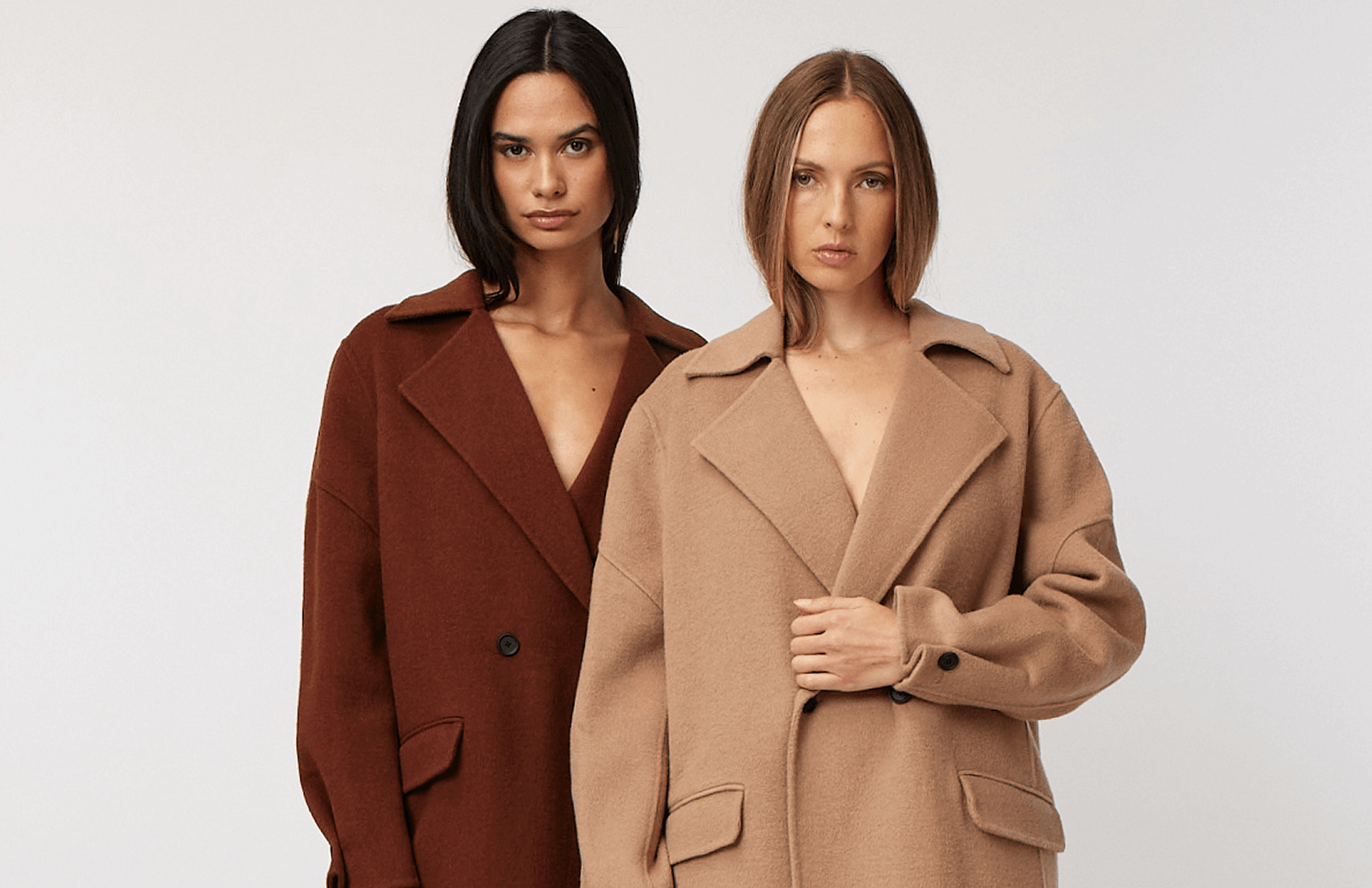 Two Woman Wearing Matching Coats in A Brown and A Tan Shade